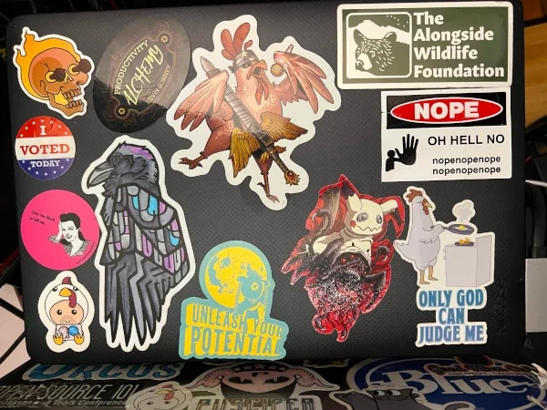 Kevin Sonney's laptop with various decals