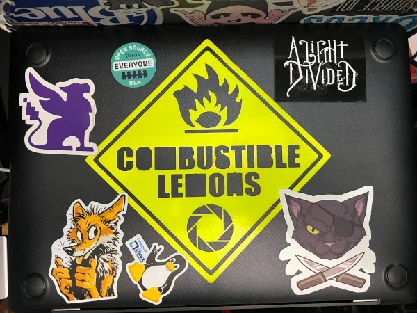Kevin Sonney's laptop with various decals