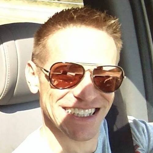 Paul Gilzow wearing sunglasses and smiling
