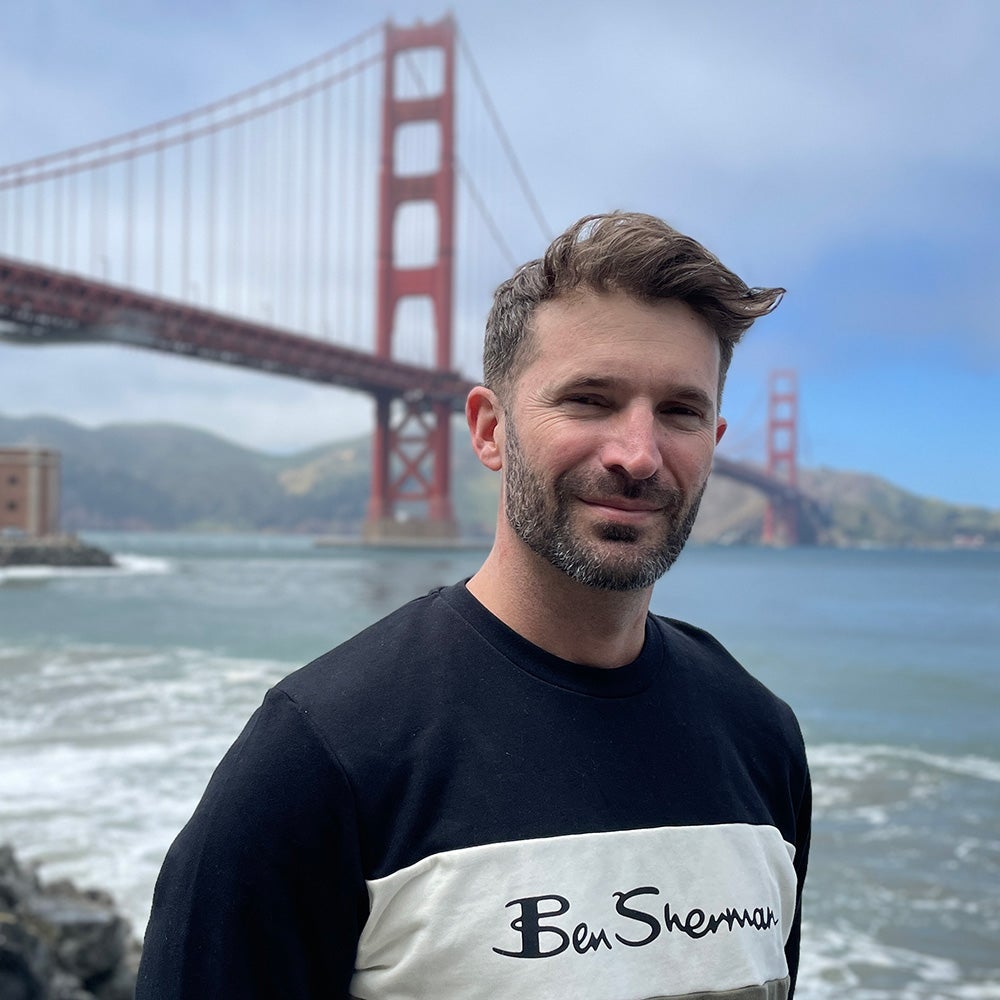 David Ryan standing by the Golden Gate Bridge in San Francisco