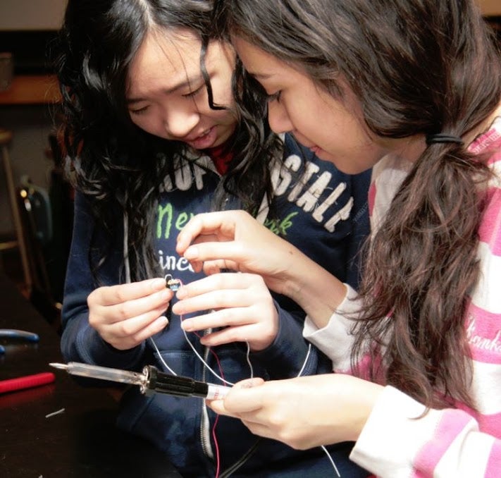 Two students working with Arduino in science class