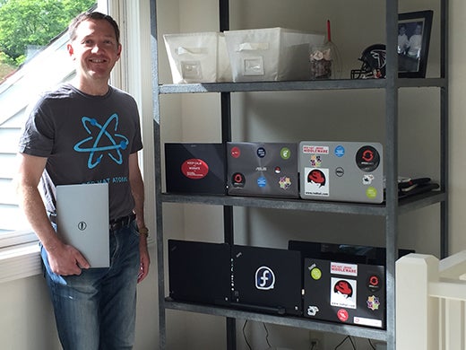 Red Hat CEO Jim Whitehurst with his Linux laptops