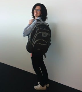 Rikki wearing Opensource.com backpack in blue