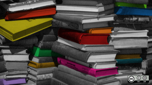 Stack of books in black and white with a few colored ones