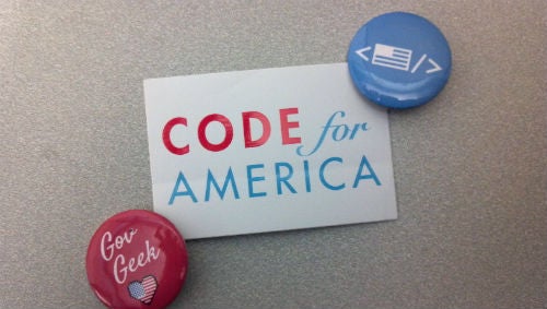 Code for America sickers and pins.