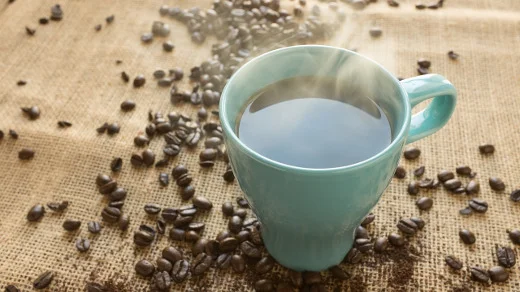 Coffee beans and a cup of coffee