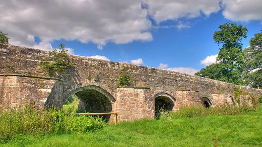 medieval bridge grass sky clouds