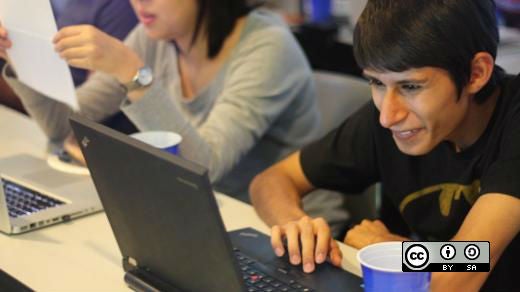 Student coding at his laptop