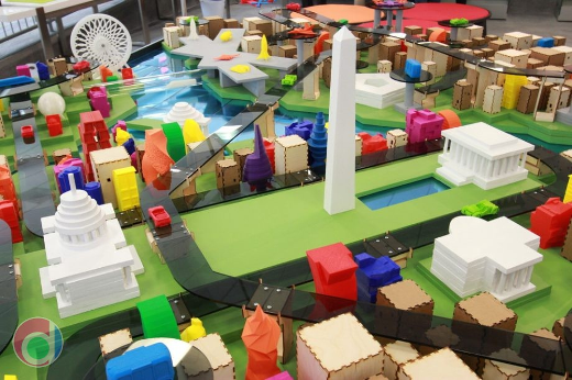 a scale model, artistic interpretation of the future of Washington, DC, featuring 3D printed buildings and vehicles