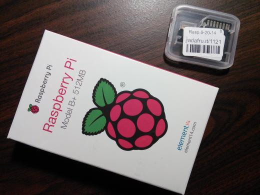 Box of the Raspberry Pi model B+ and the Raspbian microSD card