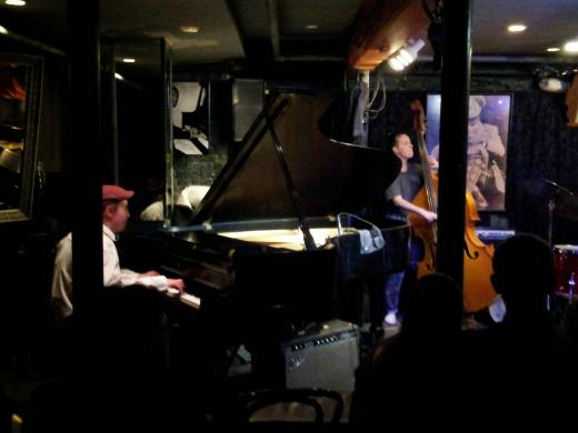 Instrument set up at Smalls Jazz Club in New York city, Piano and Bass in front of the room
