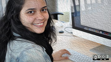 Women smiling from her computer screen