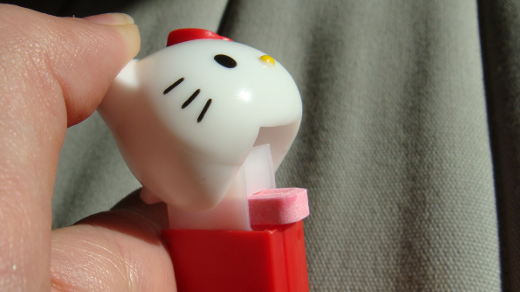 Hello kitty pez dispenser with hand and candy