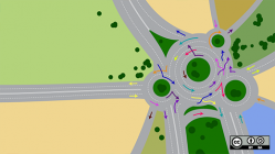 Traffic circle with arrows pointing which way to go