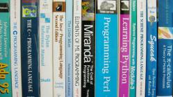 Programming books on a shelf