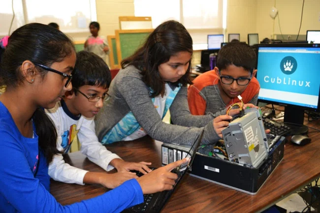 Tech Stewardship students working on a computer