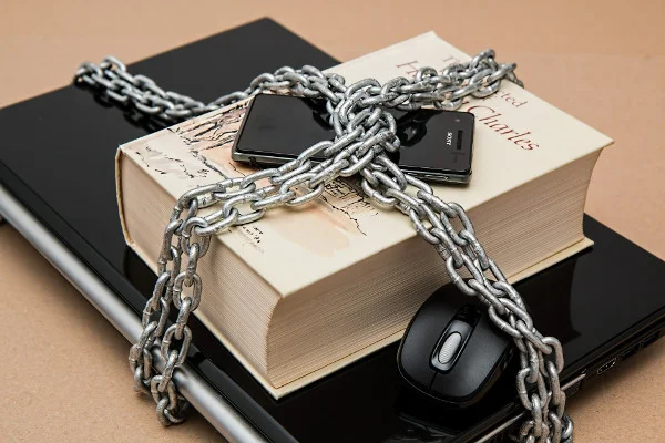 A padlocked laptop and smartphone