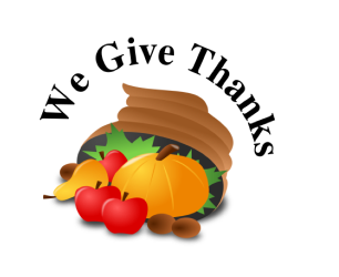 A cartoon of a brown cornucopia with red apples, an orange pumpkin, and brown nuts spilling out, with the words "We Give Thanks" in an arch over the top
