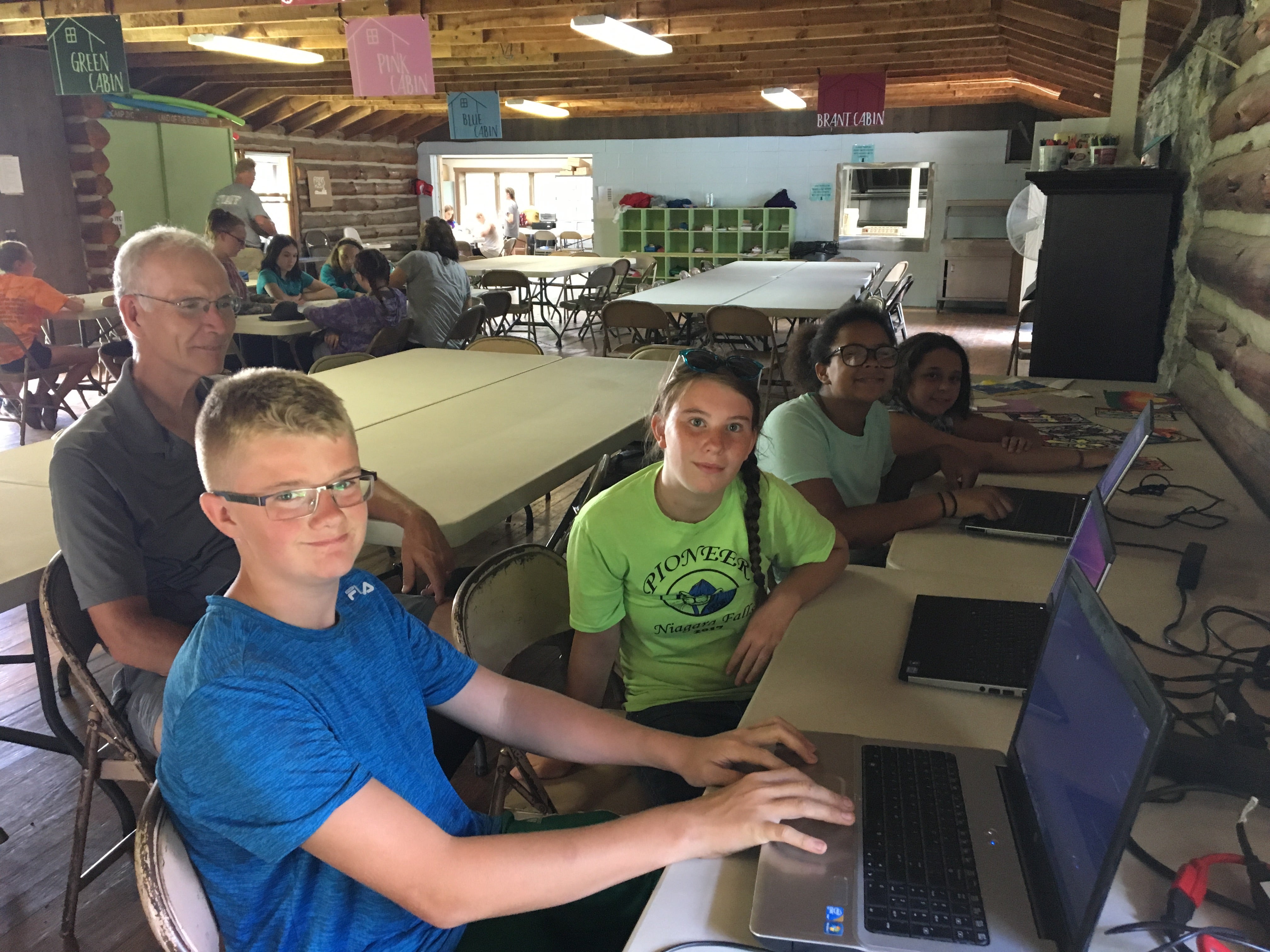 Kids learning Linux on computers
