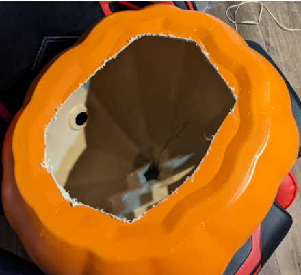 A hole that takes up most of the bottom of the plastic jack o'lantern