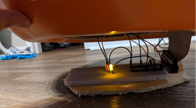 The breadboard and cables fit inside the hole in the bottom of the jack o'lantern