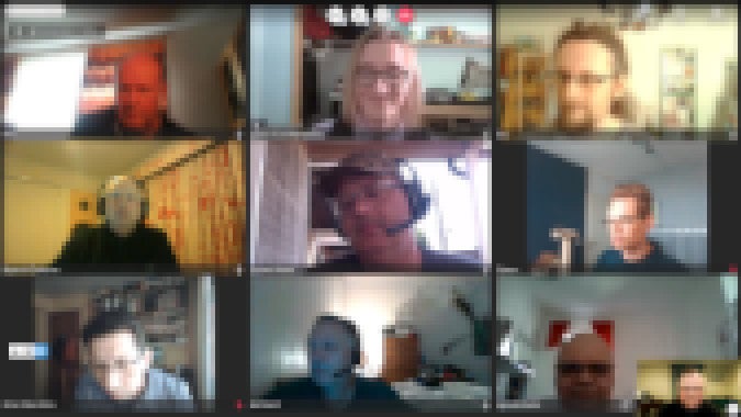 Screenshot of zoom call participants with names and faces blurred
